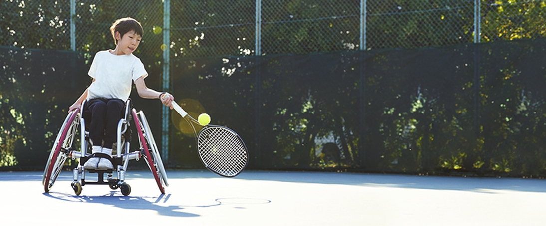 young-boy-playing-wheelchair-tennis-welcome-to-hollister-incorporated